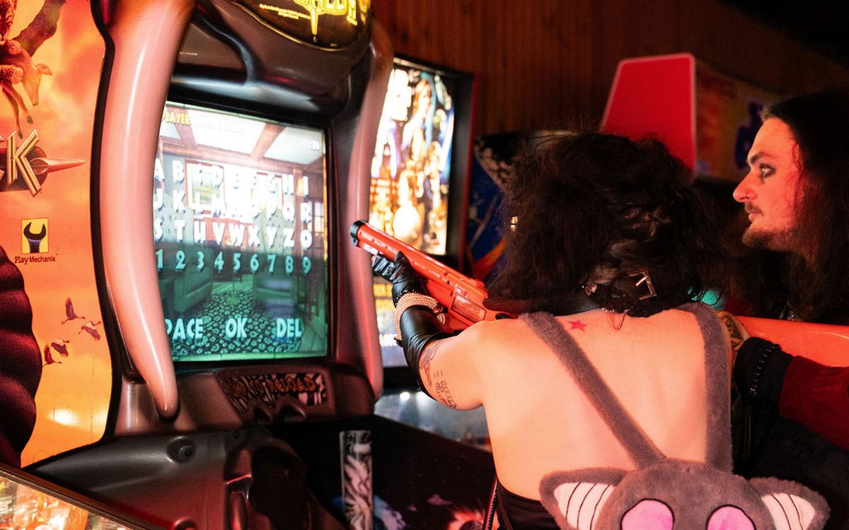 Two guests taking aim at Big Buck Hunter World